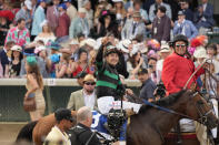 Brian Hernandez Jr. celebrates in the winner's circle after riding Mystik Dan to win the 150th running of the Kentucky Derby horse race at Churchill Downs Saturday, May 4, 2024, in Louisville, Ky. (AP Photo/Jeff Roberson)
