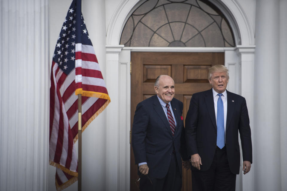 BEDMINSTER TOWNSHIP, NJ - NOVEMBER 20: President-elect Donald Trump greets Rudy Giuliani at the clubhouse at Trump National Golf Club Bedminster in Bedminster Township, N.J. on Sunday, Nov. 20, 2016. (Photo by Jabin Botsford/The Washington Post via Getty Images)