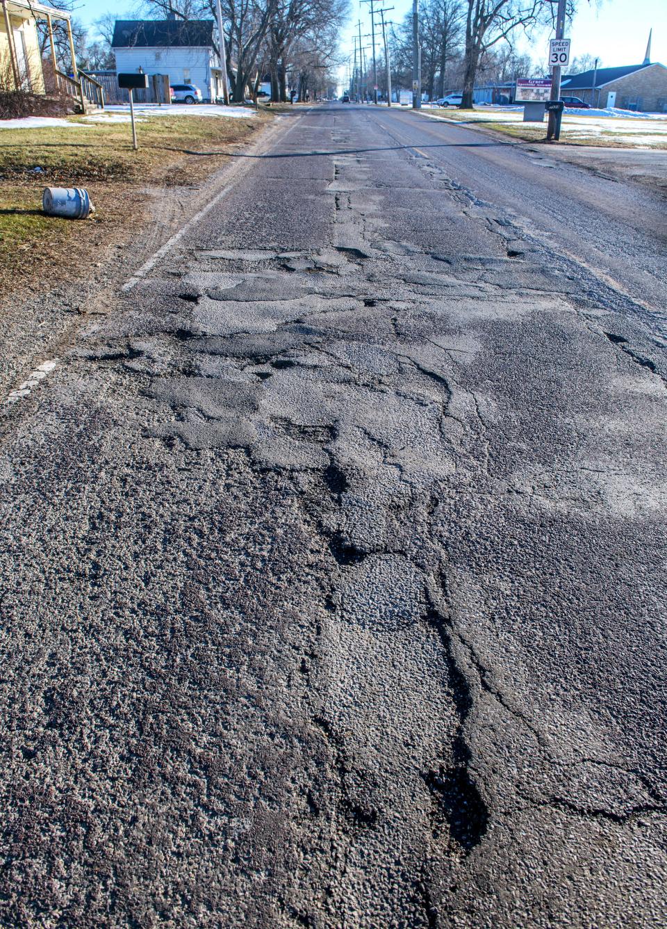 A damaged section of South Laramie Street in South Peoria.