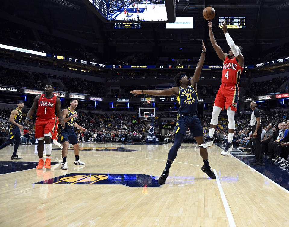 New Orleans Pelicans guard Devonte' Graham (4) takes a shot over Indiana Pacers forward Terry Taylor (21) during the second quarter of an NBA Basketball game, Monday, Nov. 7, 2022, in Indianapolis, Ind. (AP Photo/Marc Lebryk)