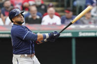 Tampa Bay Rays' Nelson Cruz watches his solo home run in the third inning of the team's baseball game against the Cleveland Indians, Friday, July 23, 2021, in Cleveland. (AP Photo/Tony Dejak)