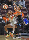 Connecticut Sun guard Jasmine Thomas commits a turnover under pressure from Chicago Sky guard Courtney Vandersloot during a WNBA semifinal playoff basketball game, Tuesday, Sept. 28, 2021, at Mohegan Sun Arena in Uncasville, Conn. (Sean D. Elliot/The Day via AP)