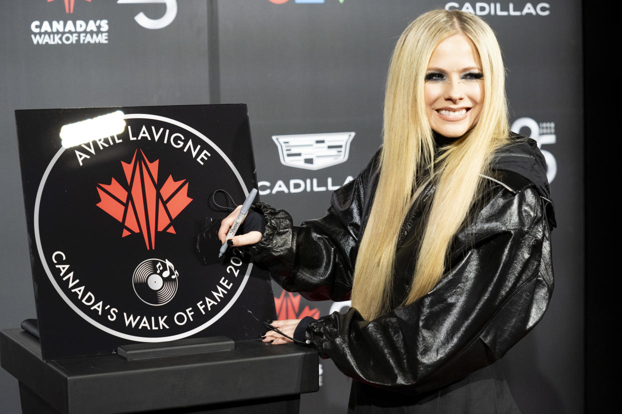 Avril Lavigne was inducted into Canada's Walk of Fame during a 25th anniversary gala in Toronto on Dec. 2. (Photo via The Canadian Press/Arlyn McAdorey)