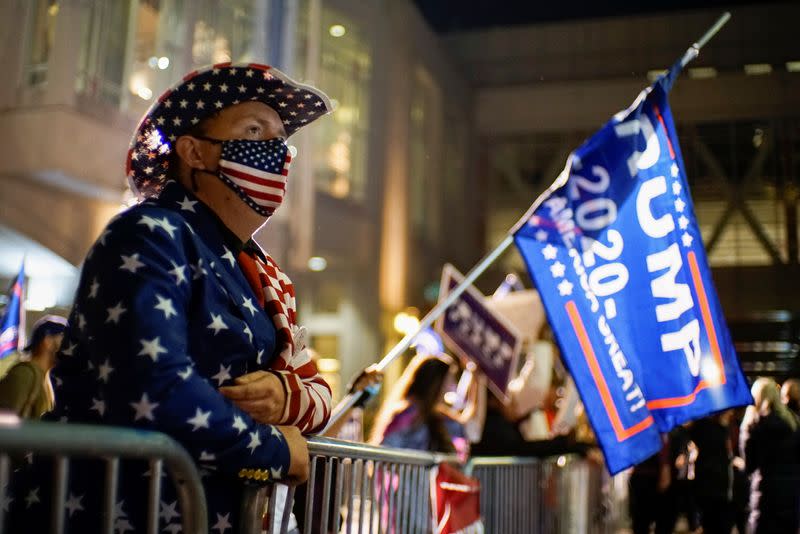 A supporter of U.S. President Donald Trump dressed with the U.S. flag colors waits for the election results as votes continue to be counted following the 2020 U.S. presidential election, in Philadelphia