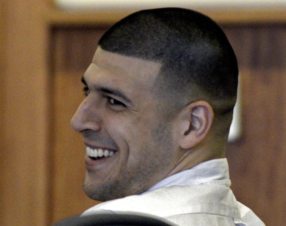 Former NFL player Aaron Hernandez appears for a hearing ahead of his upcoming trial on charges of murdering a semi-professional football player near his home in North Attleborough, Massachusetts in 2013 at Fall River Superior Court in Fall River, Massachusetts, September 30, 2014. Hernandez is also charged with shooting dead two men outside a Boston nightclub in 2012 in a separate case. REUTERS/Ted Fitzgerald/Pool (UNITED STATES - Tags: CRIME LAW SPORT FOOTBALL)