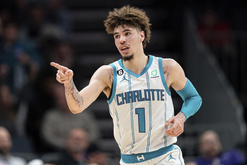 Charlotte Hornets guard LaMelo Ball reacts after making a basket during the second half of the team's NBA basketball game against the Indiana Pacers in Charlotte, N.C., Wednesday, Nov. 16, 2022. (AP Photo/Jacob Kupferman)