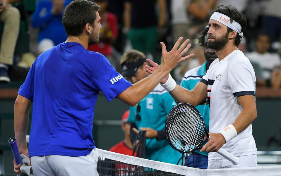 Cameron Norrie shakes hands with Nikoloz Basilashvili after defeating him in the singles final - FR171591 AP