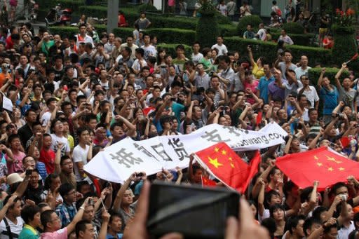 Protesters take part in a demonstration in Chengdu in China's Sichuan province against Japan's claim of the Diaoyu islands on August 19. Anti-Japan protests broke out on August 19 in more than a dozen Chinese cities as authorities allowed thousands of people to vent anger over an escalating territorial row