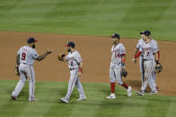 Washington Nationals' Eric Thames (9) and Adam Eaton (2) celebrate with teammates Starlin Castro (14) and Trea Turner (7) after a baseball game against the New York Mets Tuesday, Aug. 11, 2020, in New York. The Nationals won 2-1. (AP Photo/Frank Franklin II)