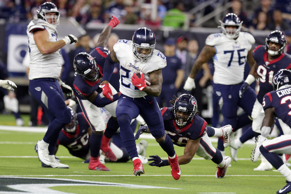 Tennessee Titans running back Derrick Henry (22) breaks away from Houston Texans linebacker Peter Kalambayi (58) to run for a 53-yard touchdown during the second half of an NFL football game Sunday, Dec. 29, 2019, in Houston. The run moved Henry into first place for the season rushing record. The Titans won 35-14. (AP Photo/Michael Wyke)