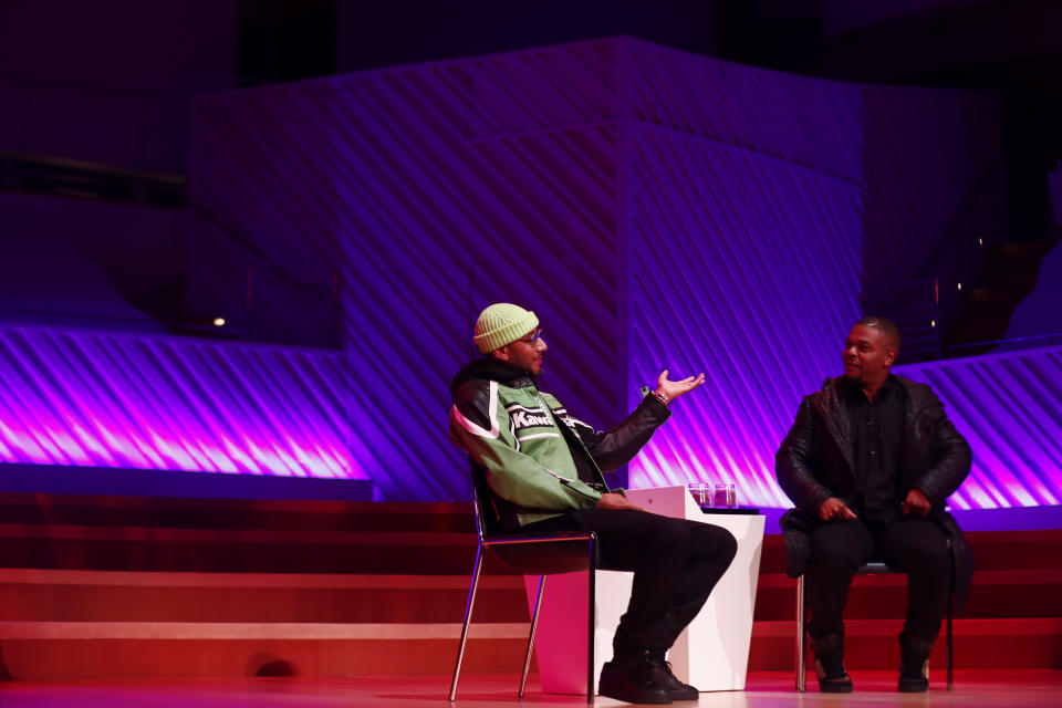 Kehinde Wiley, right, and Swizz Beatz speak during Art Basel, Monday, Dec. 2, 2019, in Miami Beach, Fla. (AP Photo/Brynn Anderson)