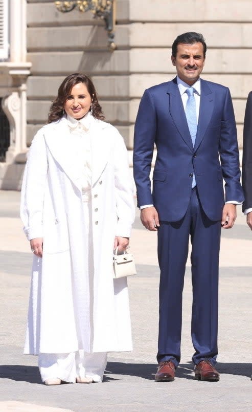 the sheikh and sheikha standing together outside