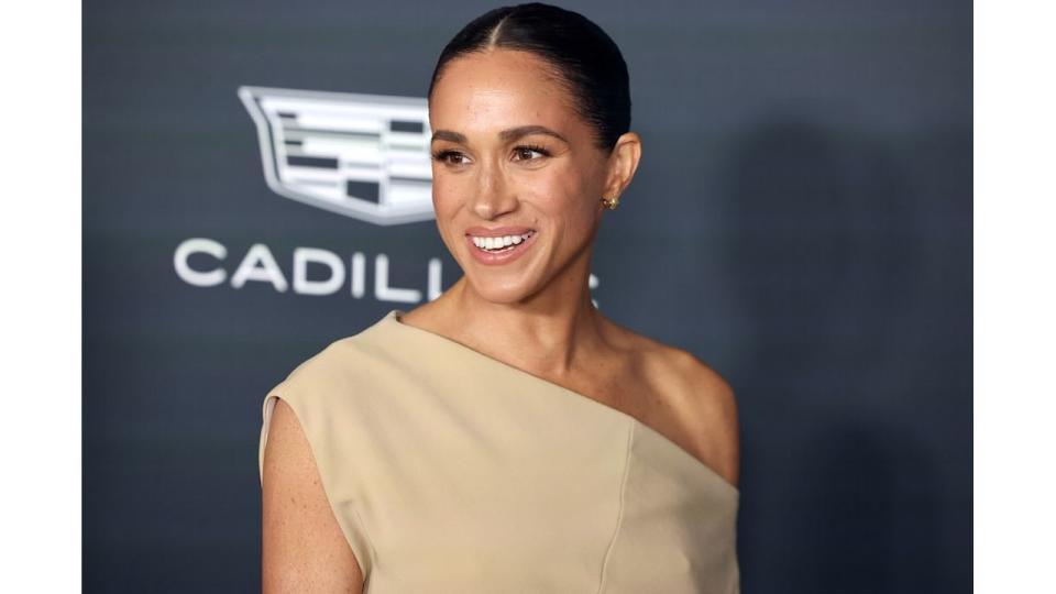 Meghan Markle in a tan dress