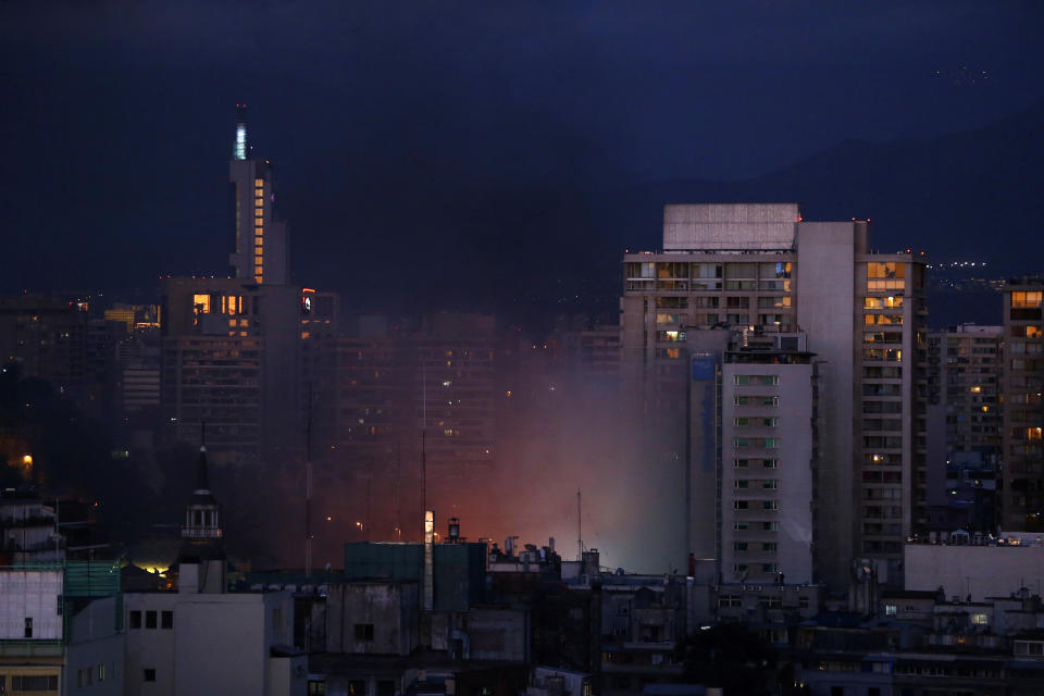 Smoke is seen from a burning shopping mall during an anti-government protest in Santiago, Chile on Oct. 28, 2019. (Photo: Ivan Alvarado/Reuters)