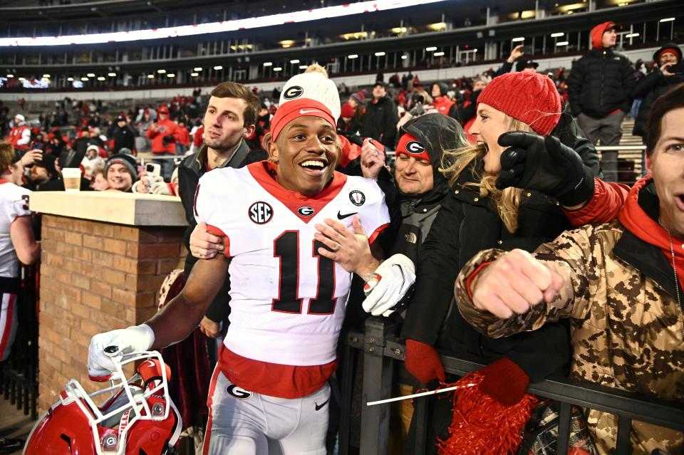 Georgia Bulldogs wide receiver Arian Smith (11) reacts with fans after a game against the Mississippi State Bulldogs at Davis Wade Stadium at Scott Field.