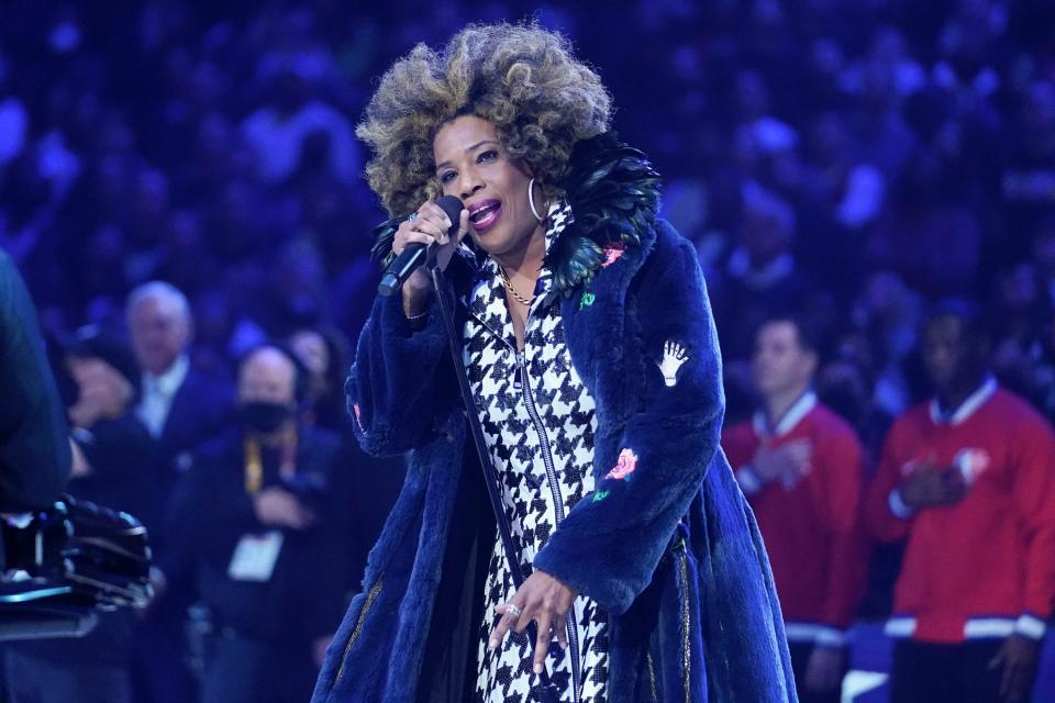 Macy Gray sings The Star Spangled Banner before the start of the NBA All-Star Game, Sunday, Feb. 20, 2022, in Cleveland. (AP Photo/Charles Krupa)