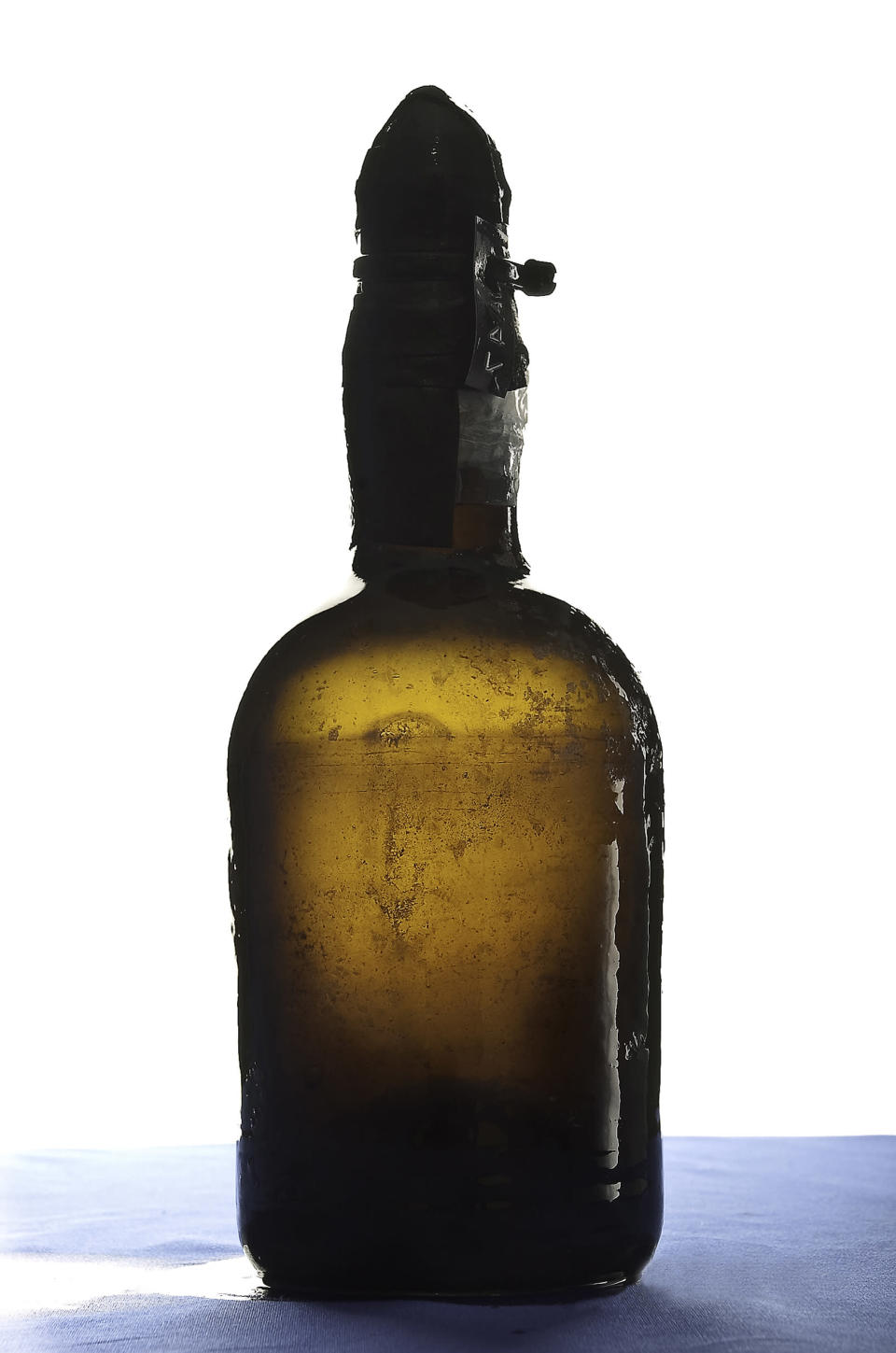 A handout photo received February 8, 2011, shows a bottle of beer that was retrieved from a shipwreck in the Aland archipelago in the summer of 2010, at the Technical Research Centre of Finland (VTT) in Espoo. Divers retrieved more than 160 bottles of champagne and five bottles of beer in July 2010, from the wreck of a ship that likely sank during the first half of 1800s. The beer in question is one of the world's oldest preserved beers. The VTT is to study the contents of the bottle to determine what kind of a recipe was used in the brewing of the beer and what kind of yeast caused the fermentation process. REUTERS/Augusto Mendes/The Government of Aland/Handout