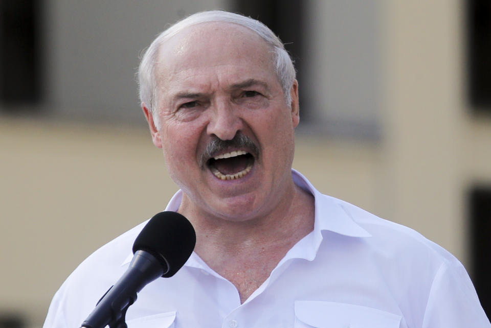 Belarusian President Alexander Lukashenko addresses his supporters gathered at Independent Square of Minsk, Belarus, Sunday, Aug. 16, 2020. Thousands of people have gathered in a square near Belarus' main government building for a rally to support President Alexander Lukashenko, while opposition supporters whose protests have convulsed the country for a week aim to hold a major march in the capital. (AP Photo/Dmitri Lovetsky)