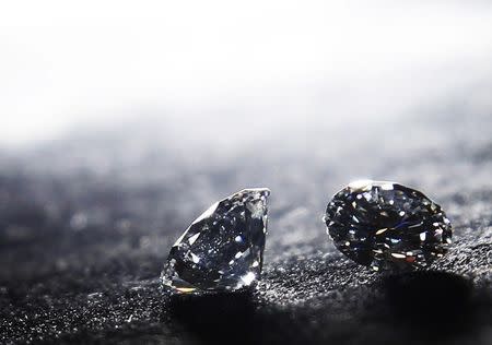 A pair of diamonds are seen on display at Serendip Jewellers in the Hatton Garden Jewellery Emporium in London April 2, 2012. REUTERS/Luke MacGregor