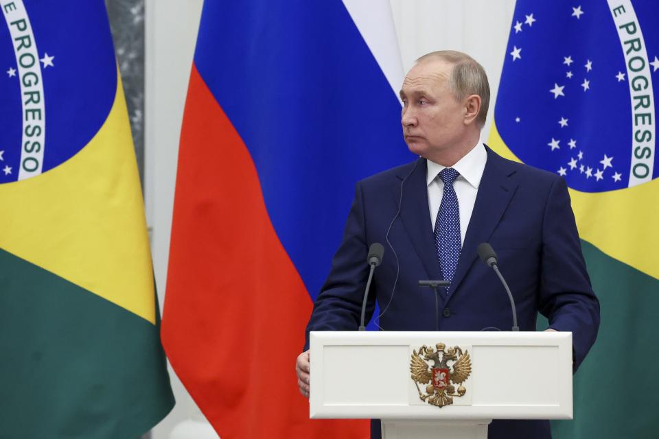 Russian President Vladimir Putin speaks during a joint news conference with Brazil's President Jair Bolsonaro following their talks in the Kremlin in Moscow, Russia, Wednesday, Feb. 16, 2022. (Mikhail Klimentyev, Sputnik, Kremlin Pool Photo via AP)