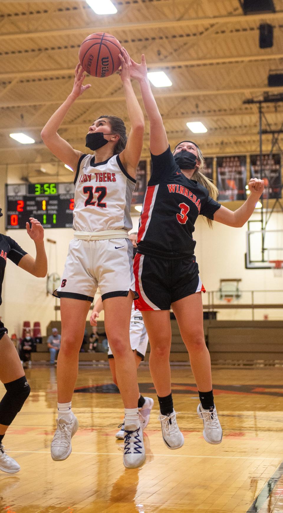 Winnebago's Annika Bielskis tries to block a shot by Byron's Ava Kultgren during the first quarter of their game on Wednesday, Jan. 19, 2022, in Byron.