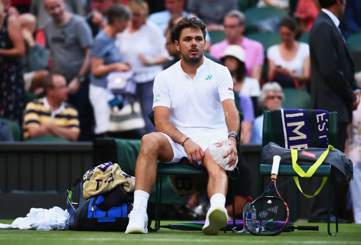 Stan Wawrinka battled knee trouble and sloppy play en route to an early exit at Wimbledon. (Getty Images)