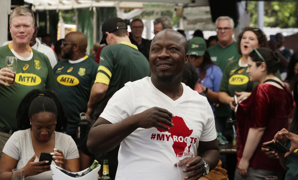 South African fans celebrate at Vilakazi street in Soweto, South Africa after their team's victory in the Rugby World Cup final between South Africa and England being played in Tokyo, Japan from Saturday Nov. 2, 2019. South Africa defeated England 32-12. (AP Photo/Themba Hadebe)