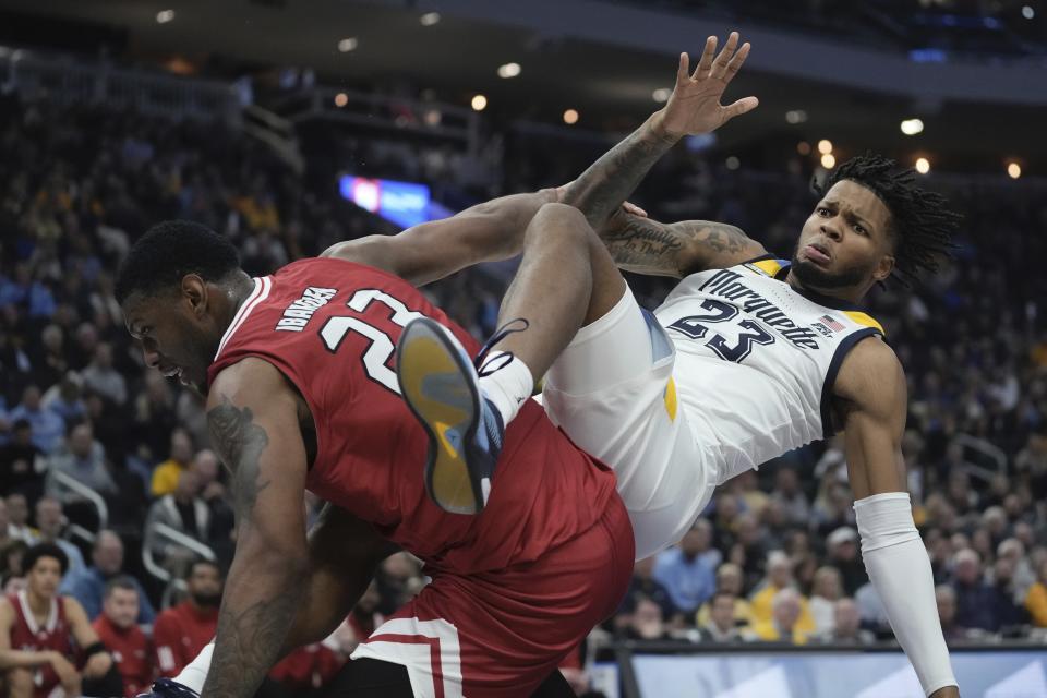 Marquette's David Joplin is fouled by Northern Illinois's Harvin Ibarguen during the first half of an NCAA college basketball game Monday, Nov. 6, 2023, in Milwaukee. (AP Photo/Morry Gash)