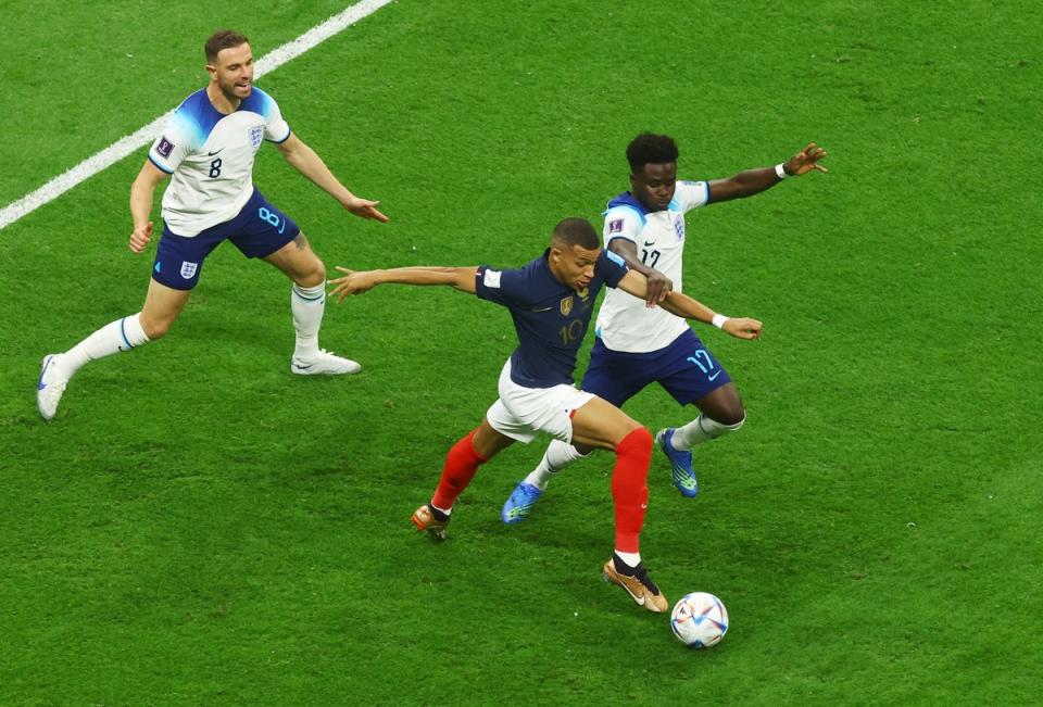 Bukayo Saka defends against Kylian Mbappe (Reuters)