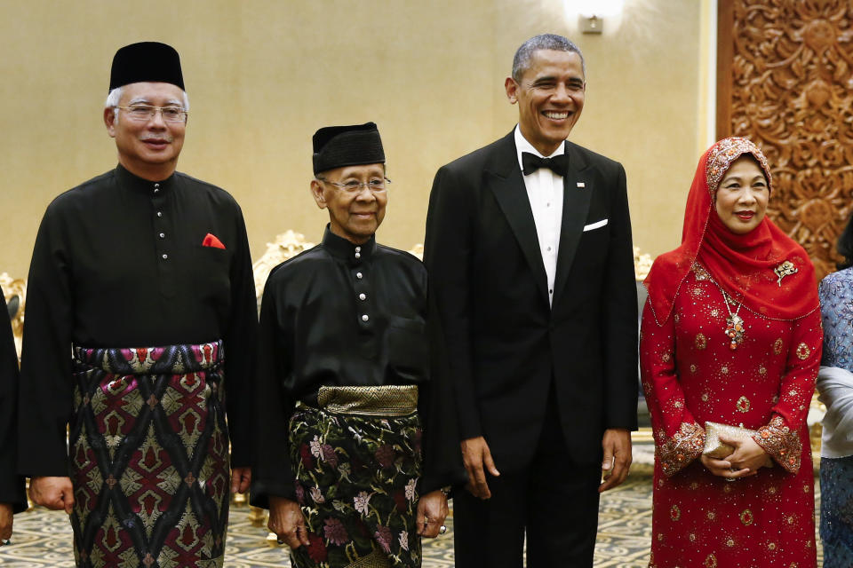 FILE - In this April 26, 2014, file photo, then U.S. President Barack Obama, second from right, stands with Malaysian King Sultan Abdul Halim Mu'adzam Shah, second from left, and Malaysian Queen Haminah Hamidun and Malaysian Prime Minister Najib Razak before a state dinner at National Palace in Kuala Lumpur, Malaysia. Sultan Muhammad V shocked the nation by announcing his abdication in January 2019, days after returning from two months of medical leave. The 49-year-old sultan from eastern Kelantan state only reigned for two years as Malaysia's 15th king and didn't give any reason for quitting. (AP Photo/Vincent Thian, File)