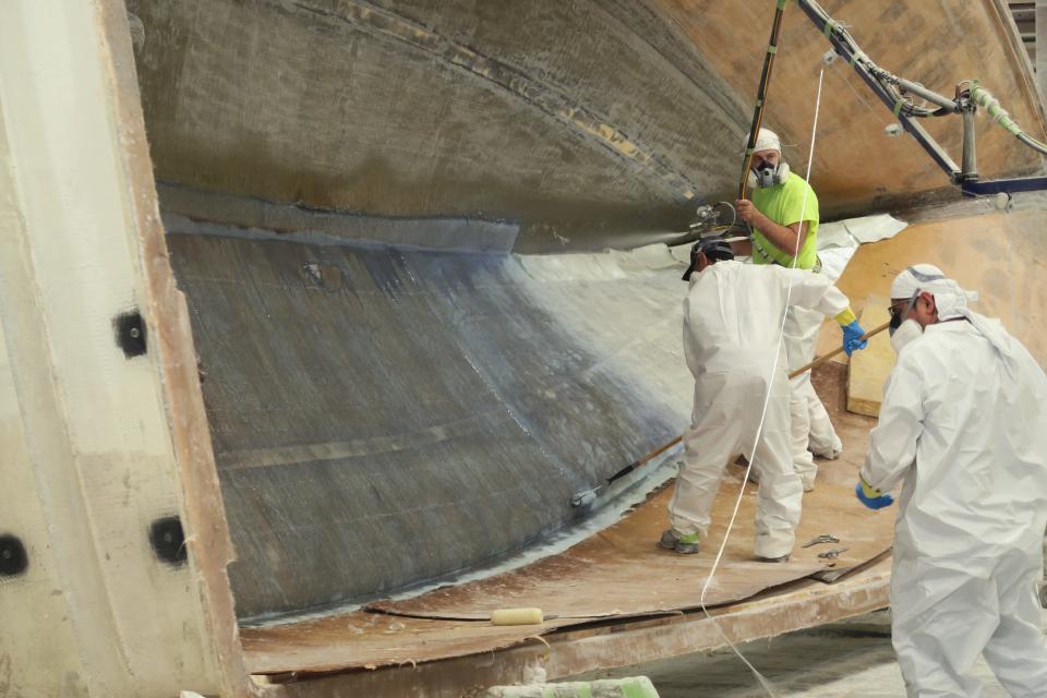 Layers of fiberglass are applied in a hull mold at Henrques Yachts' Berkeley Township facility Monday, June 6, 2022.  The Shore's boating industry would be taking advantage of a huge demand in new boaters that took off during the pandemic, if only it could solve the backlog in the supply chain. 