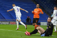 Real Madrid's Karim Benzema, left, celebrates after scoring the opening goal during a Group D Champions League soccer match between Real Madrid and Shakhtar Donetsk at the Santiago Bernabeu stadium in Madrid Spain, Wednesday, Nov. 3, 2021. (AP Photo/Manu Fernandez)