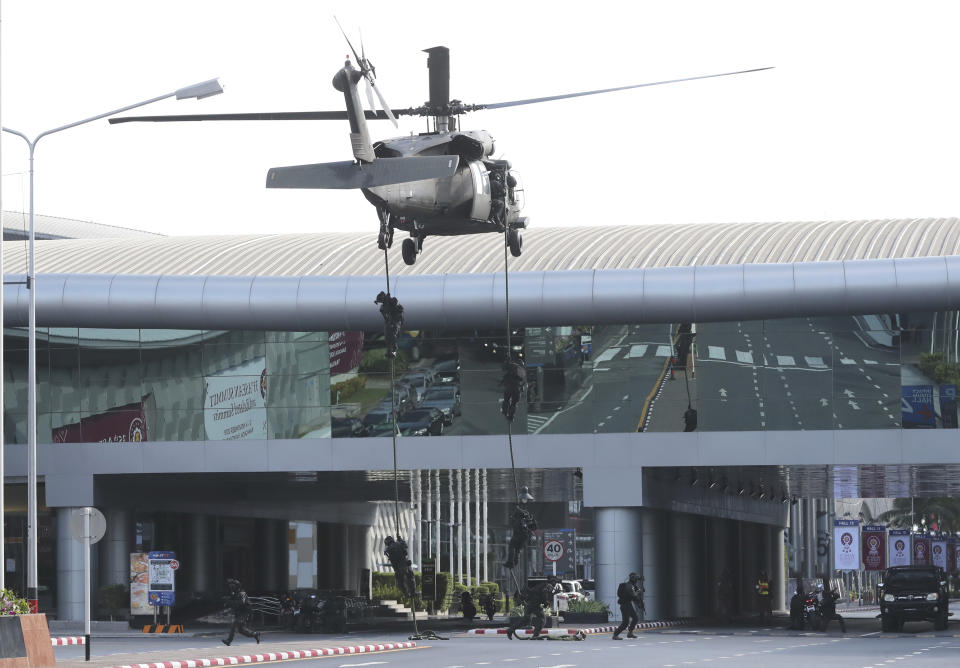 Soldiers jump from a helicopter during an emergency hostage situation exercise in Nonthaburi province, Thailand on Tuesday, Oct. 29, 2019. The 35th annual Association of Southeast Asian Nations (ASEAN) annual leaders' summit will be hosted in Thailand Nov. 2-4. (AP Photo/Sakchai Lalit)