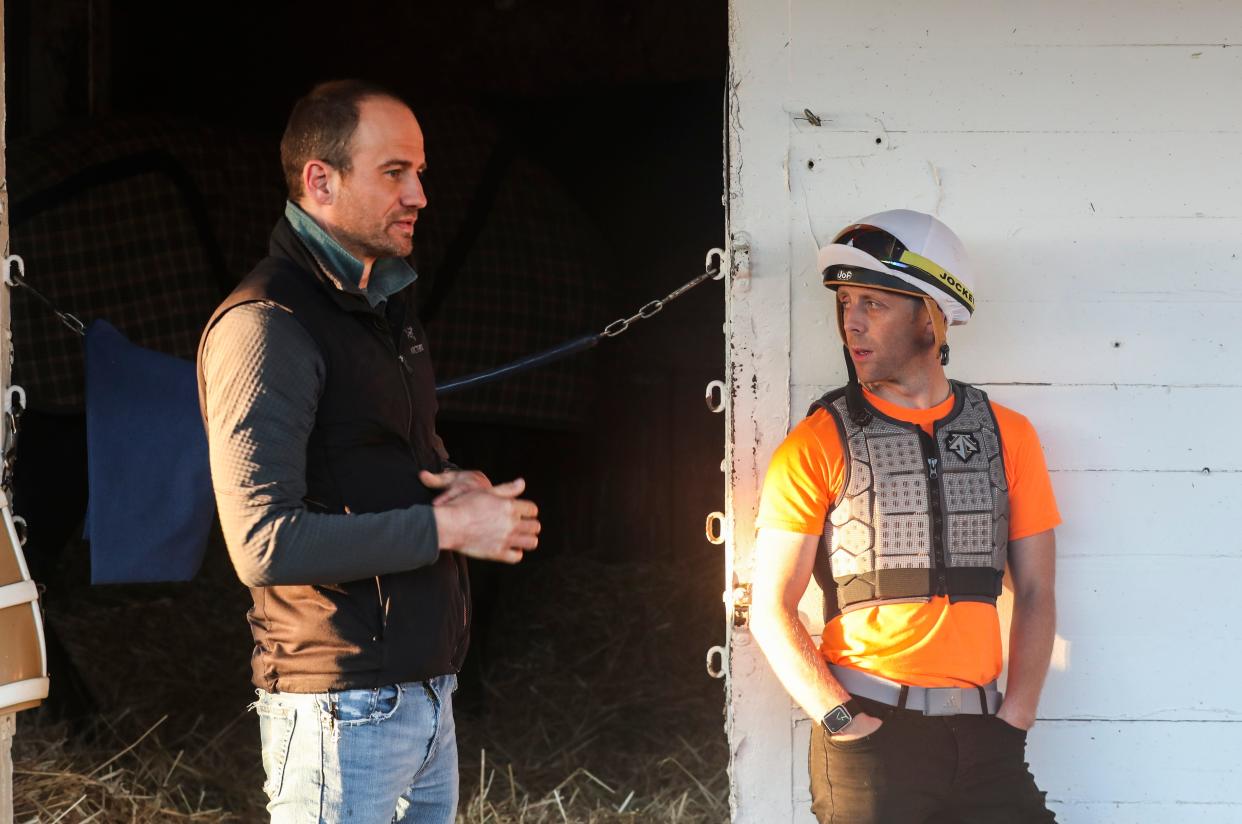 Jockey Ben Curtis talks with trainer Whit Beckman Wednesday morning, April 24, 2024, at Churchill Downs in Louisville, Ky. Curtis will ride Kentucky Derby contender Honor Marie for the Kentucky Derby race May 4, 2024.