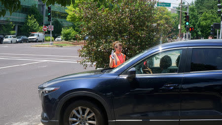 Pro-Life supporter attempts to give info outside the Reproductive Health Services of Planned Parenthood St. Louis Region, Missouri's sole abortion clinic, in St. Louis, Missouri, U.S. May 28, 2019. REUTERS/Lawrence Bryant