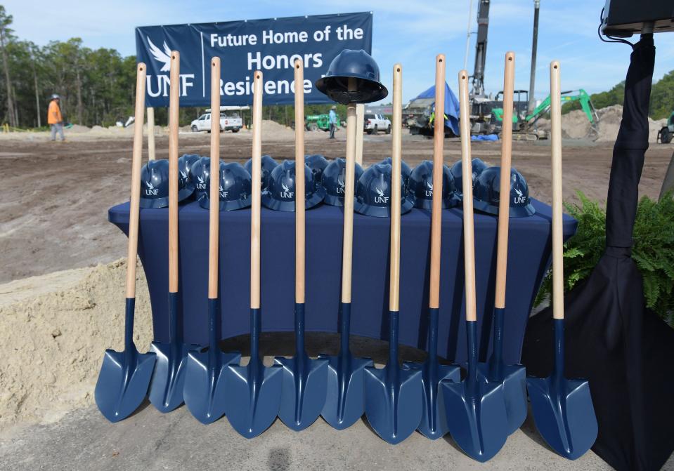 Shovels and hard hats are lined up for the ceremonial groundbreaking for construction of the new Honors Residence Hall on the University of North Florida campus Friday. The project is part of UNF's five-year plan that includes growing the student population by 8,000 to 25,000 students.