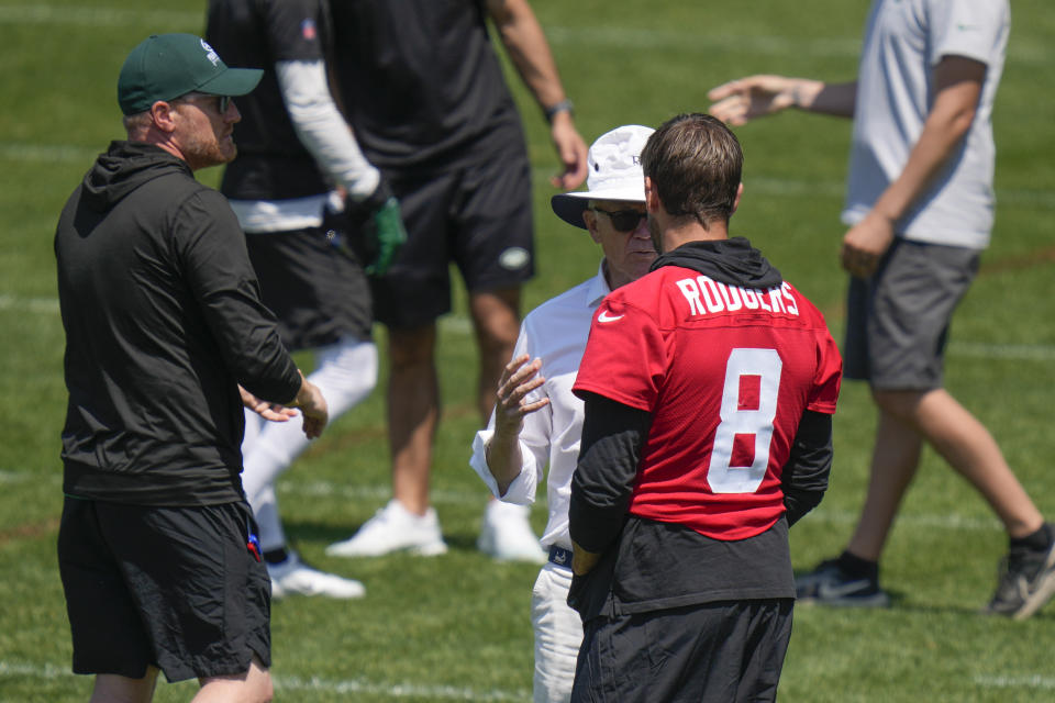 New York Jets owner Woody Johnson talks with quarterback Aaron Rodgers (8) at the NFL football team's training facility in Florham Park, N.J., Wednesday, May 31, 2023. (AP Photo/Seth Wenig)
