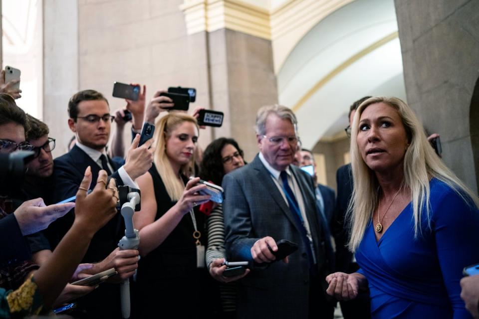 Marjorie Taylor Greene (right) speaks to reporters in the US Capitol before her second meeting with Speaker Mike Johnson on 7 May 2024. Democrats say they will vote to table her motion to vacate if she brings it forward (Getty Images)