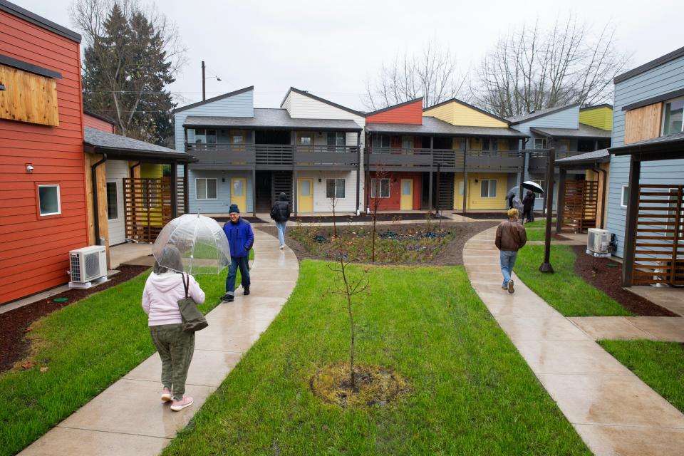 Visitors tour the Peace Village Co-op during an open house Thursday Nov. 30, 2023. Peace Village received about $1,217,900 in Affordable Housing Trust Funding from the Eugene City Council and through City Fee Assistance to support development costs.
