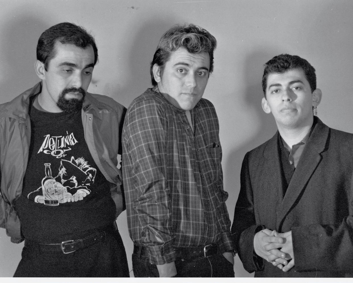 Brothers Mario Hernandez, from left, Gilbert Hernandez and Jaime Hernandez pose for a 1980s photo shoot to promote their comic book series, "Love and Rockets." The series is featured in a KCET documentary.