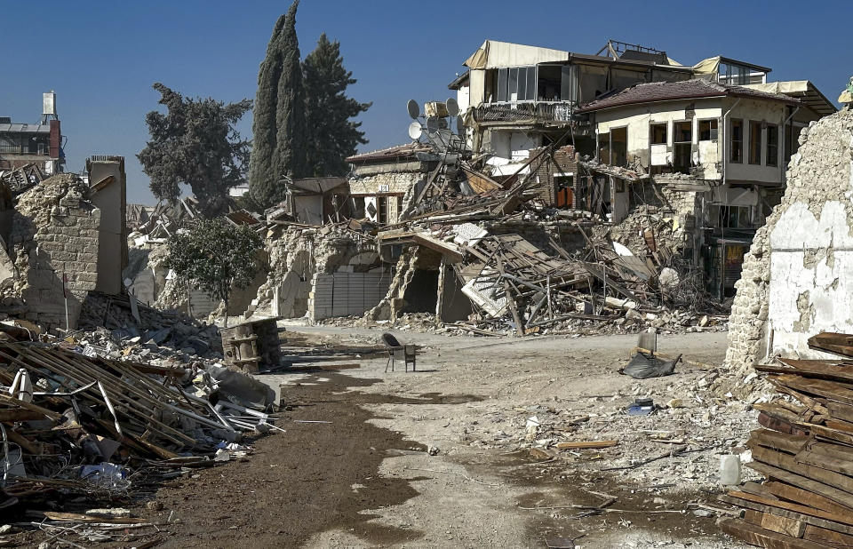 The remains of buildings destroyed during the earthquake are pictured in Antakya, southeastern Turkey Saturday, Aug. 5, 2023. Six months ago today, a devastating 7.8-magnitude earthquake hit the Kahramanmaras and 10 other provinces in southern Turkey on the morning of February 6th. Over 50,000 people died, and hundreds of thousands were left homeless, sheltering in tents and other temporary accommodation. (Halil Kahraman/dia images via AP)