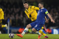 Dortmund's Giovanni Reyna, left, challenges Chelsea's Mateo Kovacic during the Champions League round of 16 second leg soccer match between Chelsea FC and Borussia Dortmund at Stamford Bridge, London, Tuesday March 7, 2023. (AP Photo/Alastair Grant)