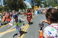 A group of indigenous dancers from the Anahuacalmecac School perform a spiritual ceremony to begin the People's Climate March protest for the environment in the Wilmington neighborhood in Los Angeles, California, U.S. April 29, 2017. REUTERS/Andrew Cullen