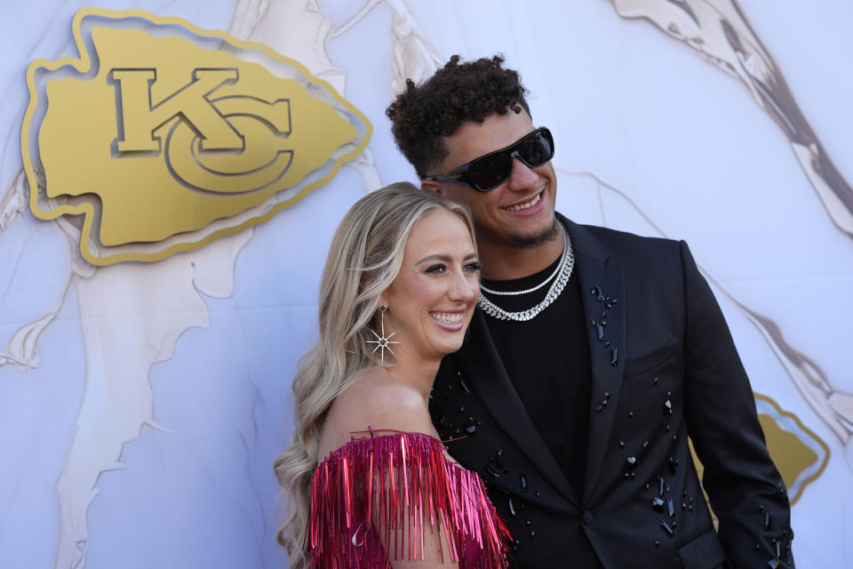 Kansas City Chiefs quarterback Patrick Mahomes and his wife Brittany arrive on the red carpet before a ceremony for team members to receive their championship rings for winning NFL's Super Bowl 58 football game Thursday, June 13, 2024, in Kansas City, Mo. (AP Photo/Charlie Riedel)