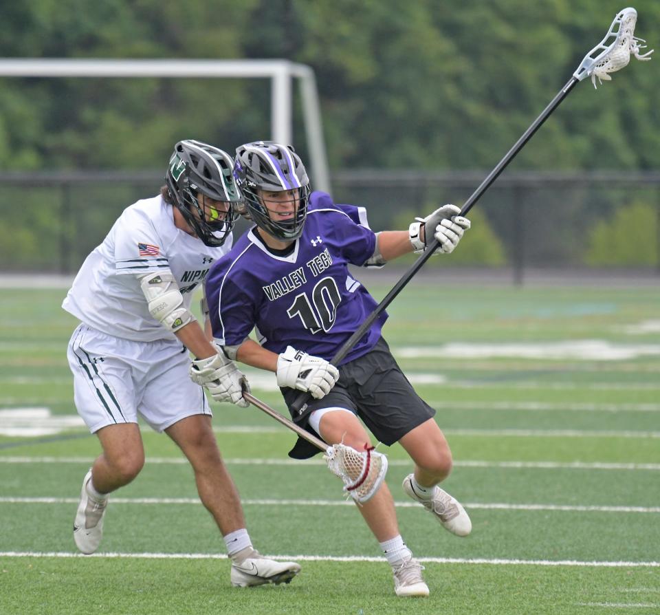 Valley Tech's Thomas Liddy, right, is pressured by Nipmuc's Collin Falconer.