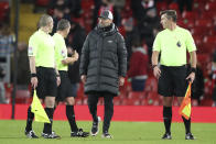 Liverpool's manager Jurgen Klopp speaks with the referee and linesmen at the end of an English Premier League soccer match between Liverpool and West Bromwich Albion at the Anfield stadium in Liverpool, England, Sunday Dec. 27, 2020. (Nick Potts/Pool via AP)