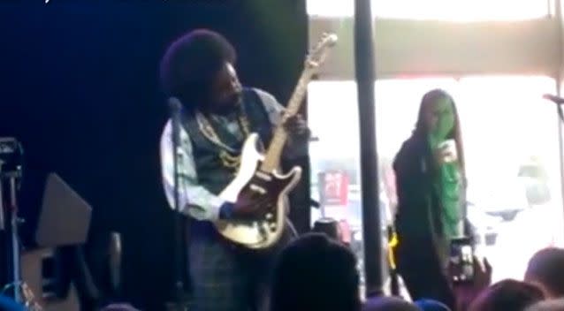 A female fan managed to jump on stage and dance with Afroman during a performance at a Mississippi club. Photo: Facebook