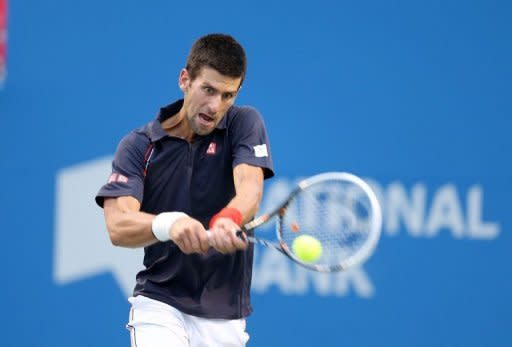 Serbia's Novak Djokovic returns a shot during his Rogers Cup final against Frenchman Richard Gasquet in Toronto on August 12. Djokovic completed a trophy hat-trick in Canada as he won the ATP Masters 1000 event with a 6-3, 6-2 victory over Gasquet