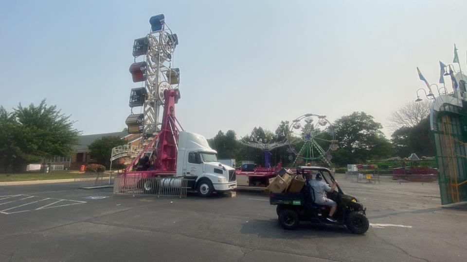 There Zipper ride (right) where two people were injured is being removed before St. John the Beloved Church Carnival resumes on Wednesday (June 7, 2023).