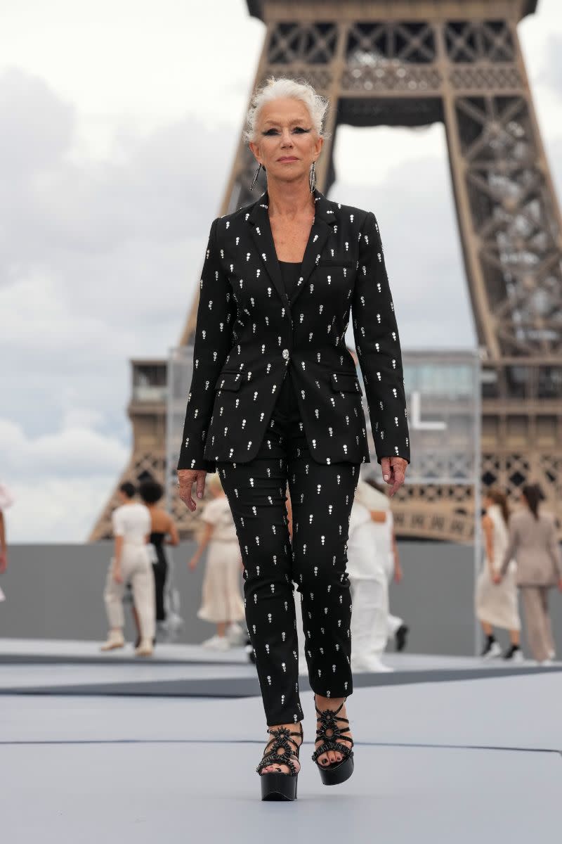 <p> Although this is a runway photo, it has to be one of our favourite Helen Mirren looks of all time. She can really pull off everything, from soft and feminine to bold and edgy, and this suit proves it. Finished off with impressive platforms, it is an unforgettable ensemble. </p>